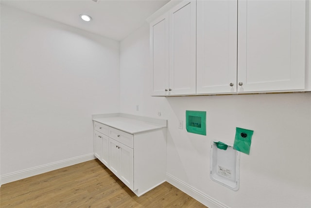 laundry area with hookup for a washing machine, recessed lighting, cabinet space, light wood-style flooring, and baseboards