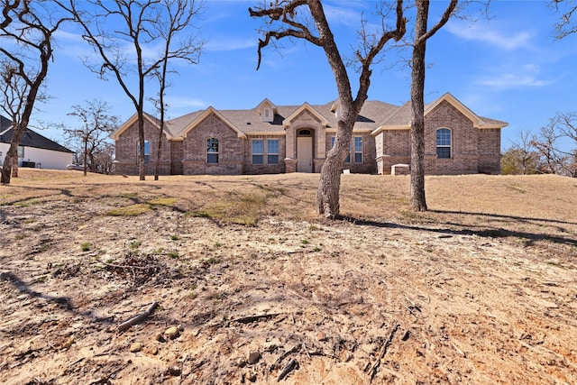 view of front of home with brick siding