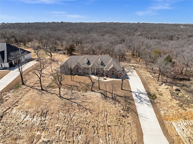 aerial view featuring a view of trees