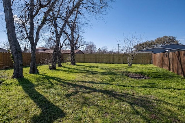 view of yard featuring a fenced backyard