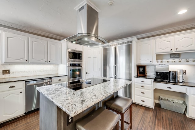 kitchen with stainless steel appliances, dark wood-type flooring, island exhaust hood, and a kitchen island