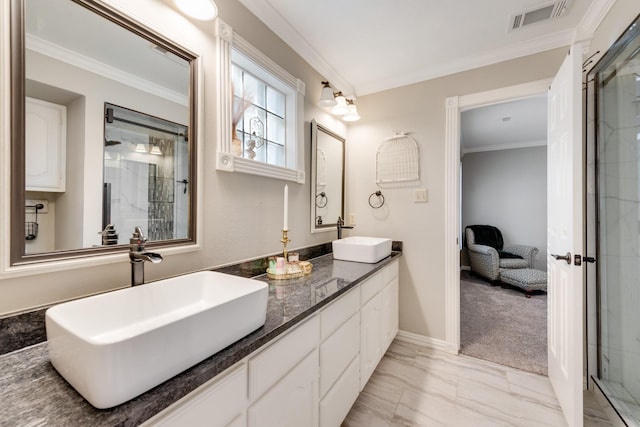 full bathroom featuring ornamental molding, a sink, and visible vents