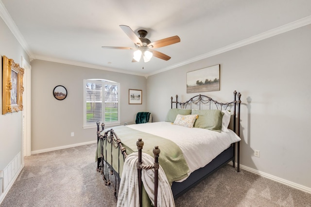 bedroom featuring carpet floors, crown molding, and baseboards