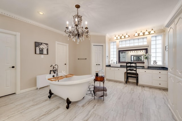 bathroom with a healthy amount of sunlight, a soaking tub, ornamental molding, and vanity