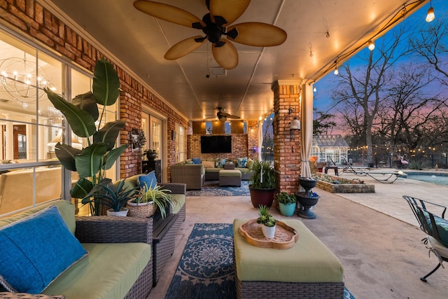 view of patio featuring a fenced in pool, ceiling fan, and an outdoor hangout area