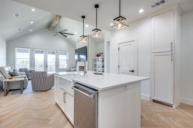 kitchen featuring visible vents, open floor plan, dishwasher, and french doors