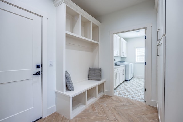 mudroom featuring washer / clothes dryer and baseboards