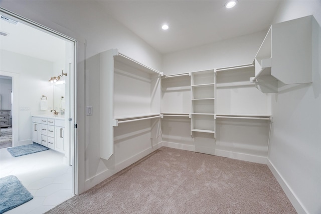 spacious closet with carpet and visible vents