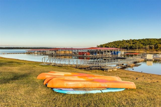 view of community featuring a yard and a water view