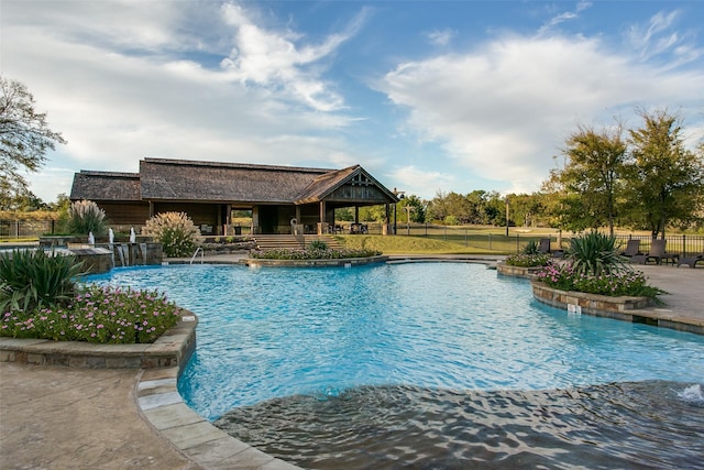 pool featuring a patio area, fence, and a gazebo