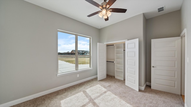 unfurnished bedroom with light colored carpet, visible vents, and baseboards