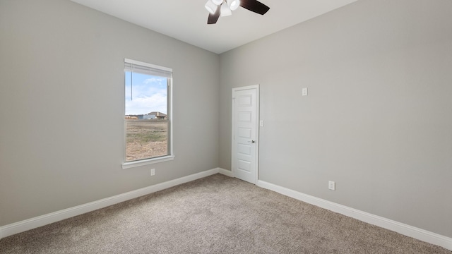 unfurnished room with ceiling fan, carpet floors, and baseboards