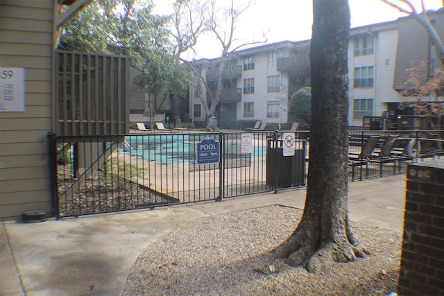 4859 Cedar Springs Rd Unit 147, Dallas, TX 75219 - community pool featuring a gate and fence