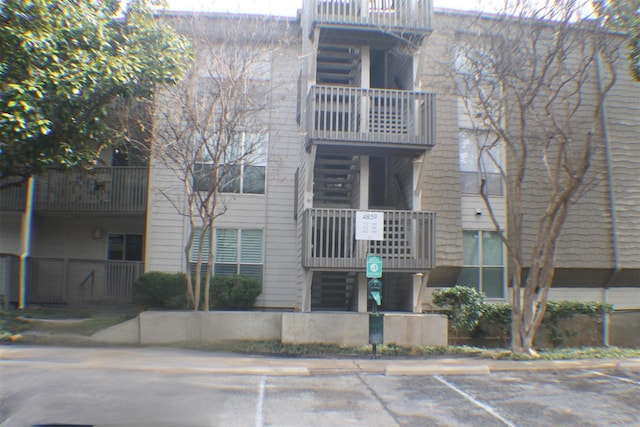 4859 Cedar Springs Rd Unit 147, Dallas, TX 75219 - view of building exterior featuring uncovered parking
