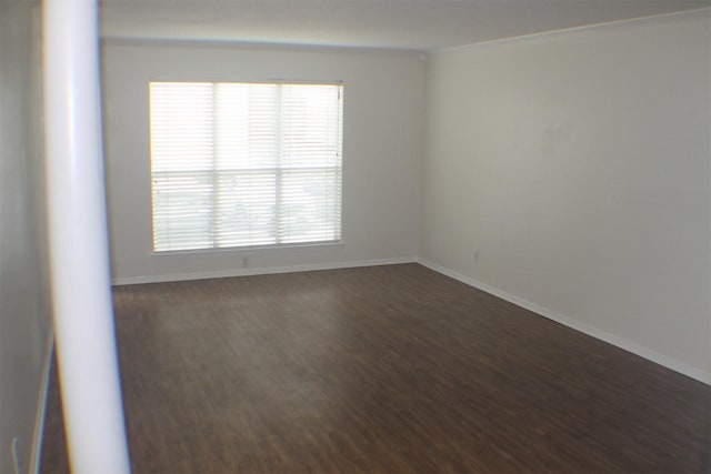4859 Cedar Springs Rd Unit 147, Dallas, TX 75219 - unfurnished room featuring baseboards and dark wood-type flooring