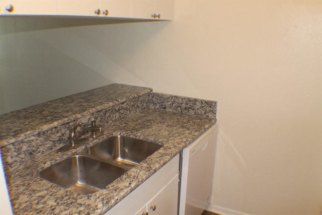 4859 Cedar Springs Rd Unit 147, Dallas, TX 75219 - kitchen featuring stone counters, white cabinets, a sink, and white dishwasher