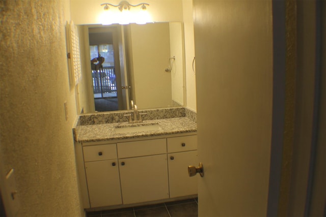 4859 Cedar Springs Rd Unit 147, Dallas, TX 75219 - bathroom featuring vanity and tile patterned floors