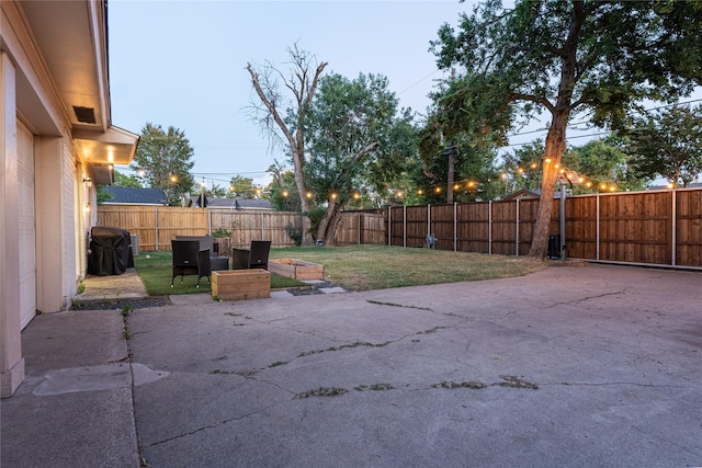 view of yard featuring a fenced backyard and a patio