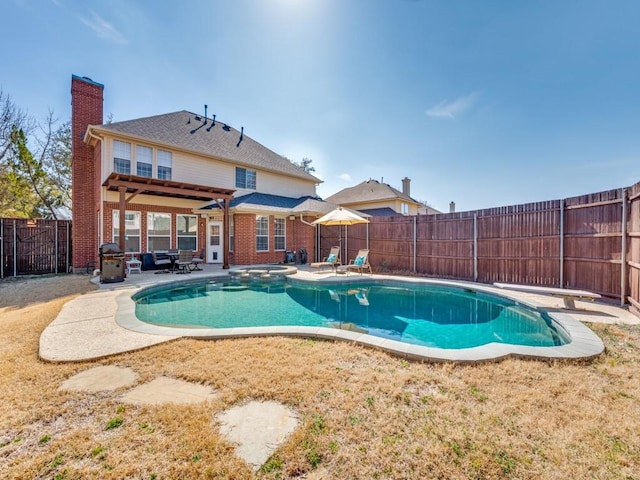 view of swimming pool with a fenced in pool, a patio, area for grilling, an in ground hot tub, and a fenced backyard