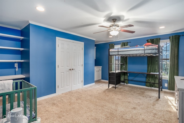 bedroom featuring carpet floors, ornamental molding, and baseboards