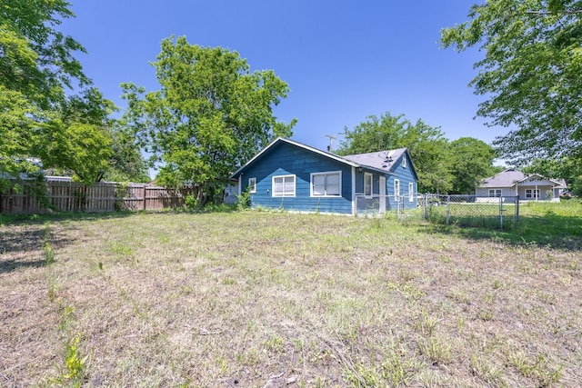 view of home's exterior with fence