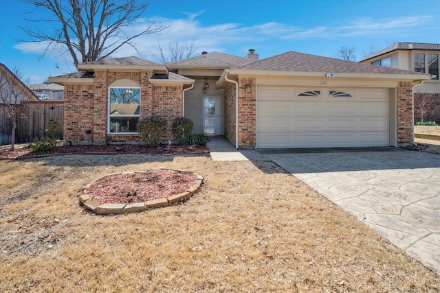 ranch-style house featuring a garage, driveway, a shingled roof, and brick siding