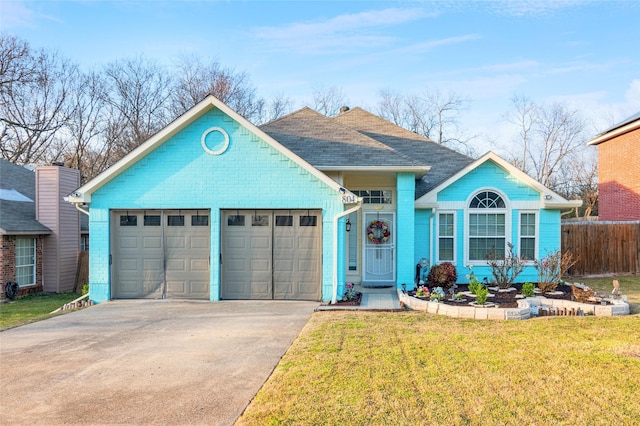 ranch-style home with a garage, fence, concrete driveway, and a front yard