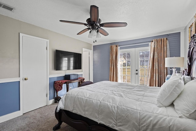 bedroom with carpet, french doors, visible vents, a textured ceiling, and access to outside