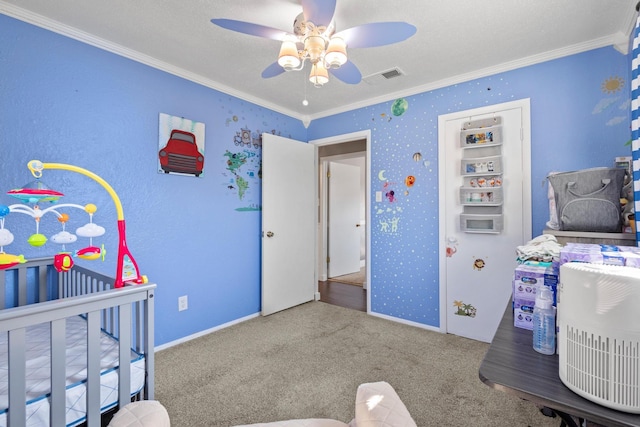 bedroom featuring carpet, crown molding, ceiling fan, a textured ceiling, and baseboards