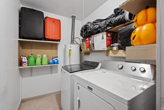 laundry room with gas water heater, baseboards, washing machine and clothes dryer, and laundry area