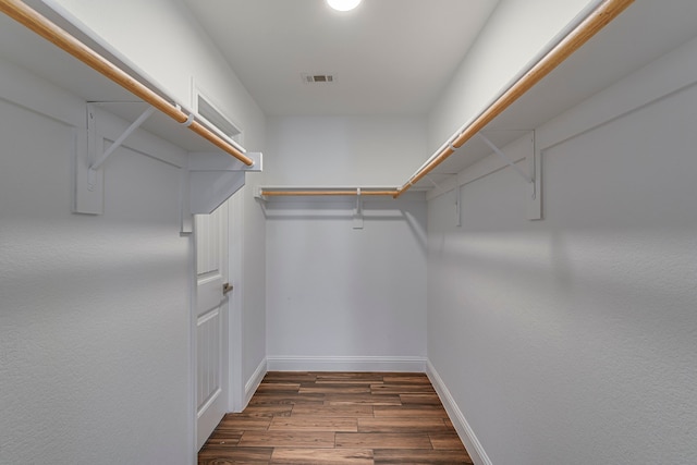 spacious closet with visible vents and wood finished floors