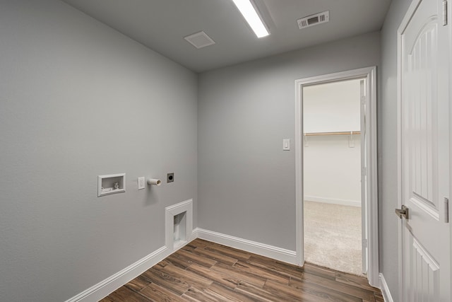 laundry area featuring dark wood-style floors, hookup for a washing machine, visible vents, electric dryer hookup, and laundry area