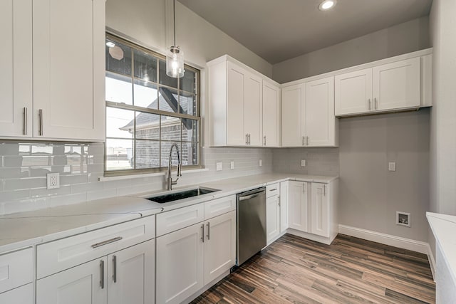 kitchen with white cabinets, dishwasher, dark wood-style flooring, a sink, and backsplash