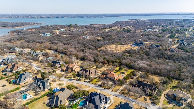 bird's eye view featuring a water view and a residential view