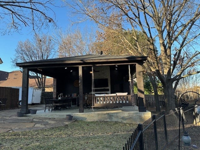 rear view of house with fence private yard and a patio area