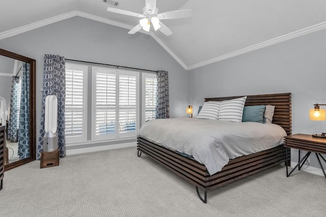 carpeted bedroom with lofted ceiling, a ceiling fan, visible vents, and crown molding