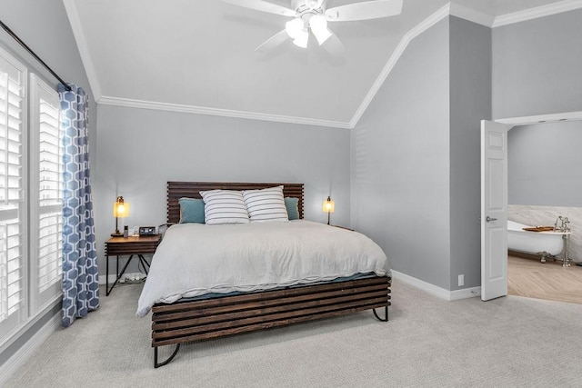 carpeted bedroom with lofted ceiling, baseboards, and ornamental molding