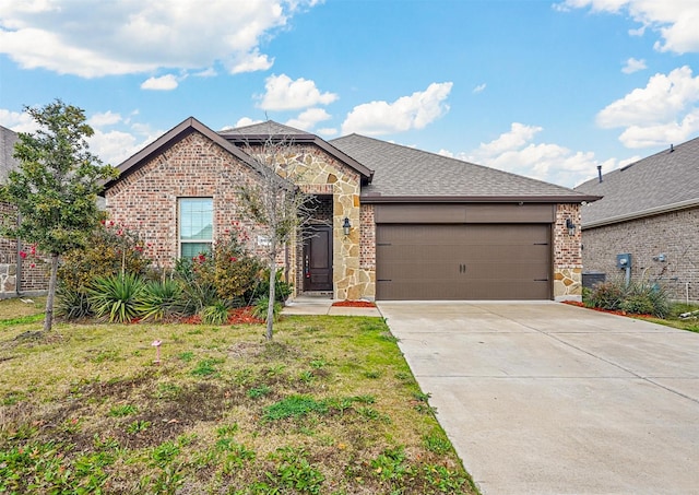 view of front of house featuring a garage, stone siding, concrete driveway, and brick siding