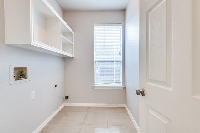 laundry area featuring light tile patterned floors, hookup for a washing machine, hookup for an electric dryer, laundry area, and baseboards