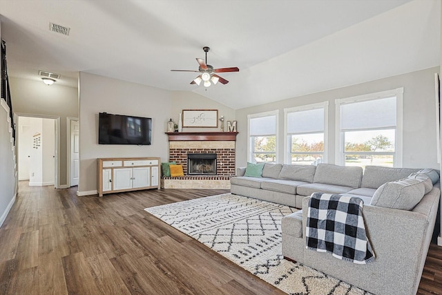 7910 Stone Ridge Dr, Northlake, TX 76247 - living room featuring a ceiling fan, dark wood finished floors, vaulted ceiling, baseboards, and a brick fireplace
