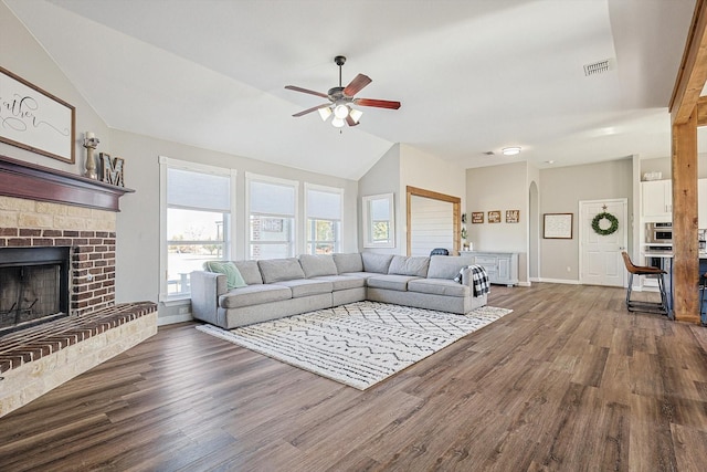 7910 Stone Ridge Dr, Northlake, TX 76247 - living area featuring vaulted ceiling, a ceiling fan, wood finished floors, a fireplace, and baseboards