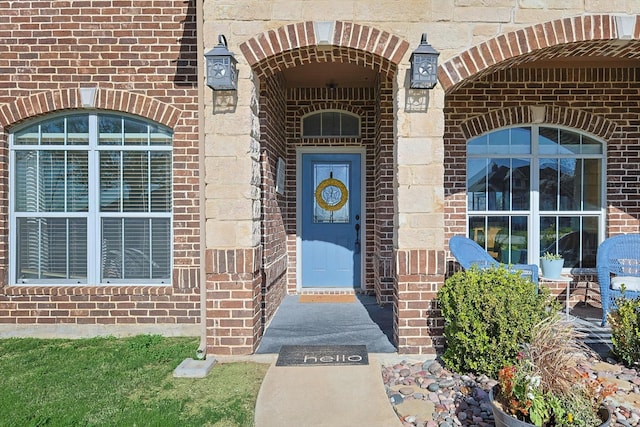 entrance to property with brick siding