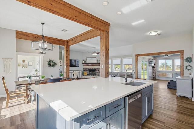 7910 Stone Ridge Dr, Northlake, TX 76247 - kitchen featuring a sink, ceiling fan, stainless steel dishwasher, open floor plan, and beam ceiling