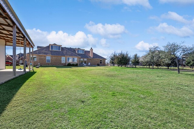 7910 Stone Ridge Dr, Northlake, TX 76247 - view of green lawn featuring a patio area