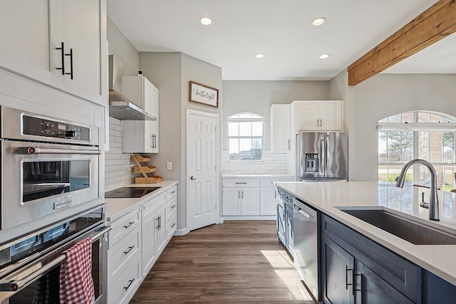 7910 Stone Ridge Dr, Northlake, TX 76247 - kitchen with appliances with stainless steel finishes, a sink, healthy amount of natural light, recessed lighting, and white cabinets