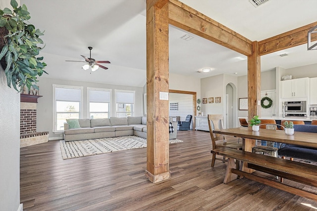 7910 Stone Ridge Dr, Northlake, TX 76247 - dining area with ceiling fan, dark wood-style flooring, arched walkways, and baseboards