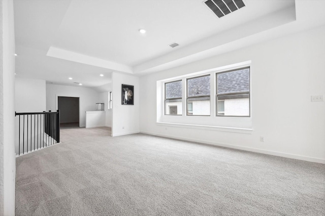 empty room featuring recessed lighting, visible vents, baseboards, and light colored carpet