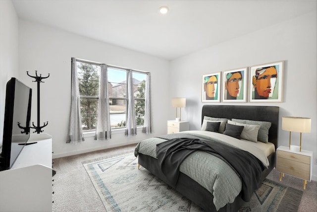 bedroom featuring carpet flooring and baseboards