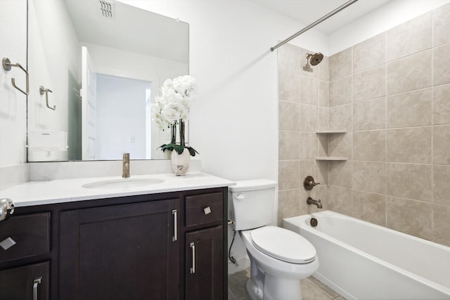 bathroom with bathtub / shower combination, visible vents, toilet, vanity, and tile patterned floors