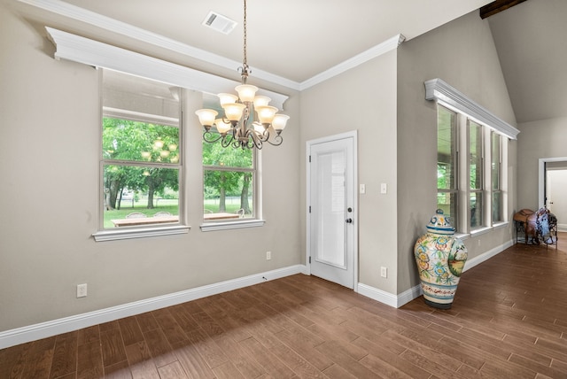 interior space with a wealth of natural light, wood finished floors, visible vents, and baseboards